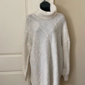 Cream-colored over-sized turtleneck sweater